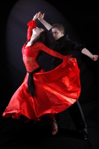 Dancers against black background