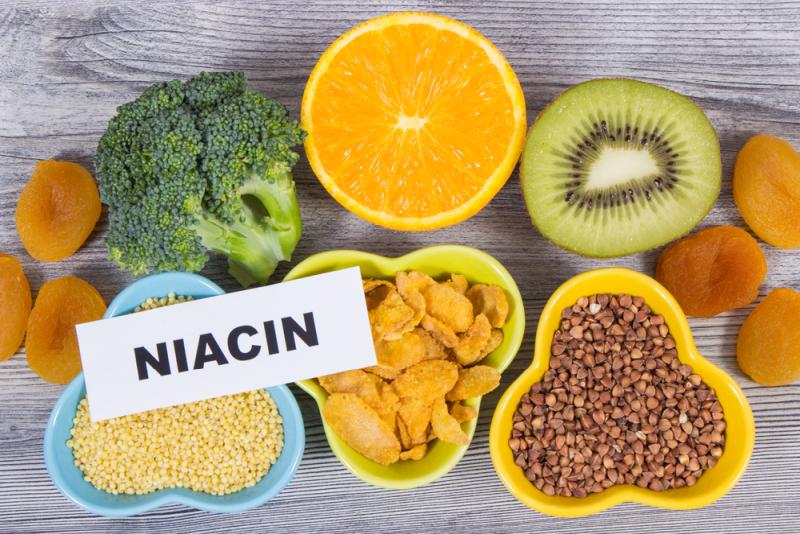 Niacin And Other Foods In Bowls On A Wooden Table, Beneficial For ...