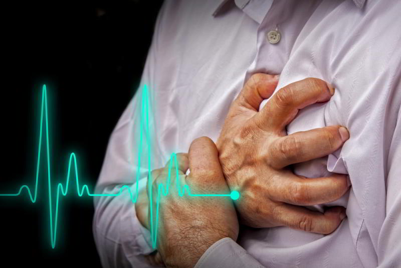 A man is holding his chest with an ecg on it while emphasizing the importance of maintaining brain health.